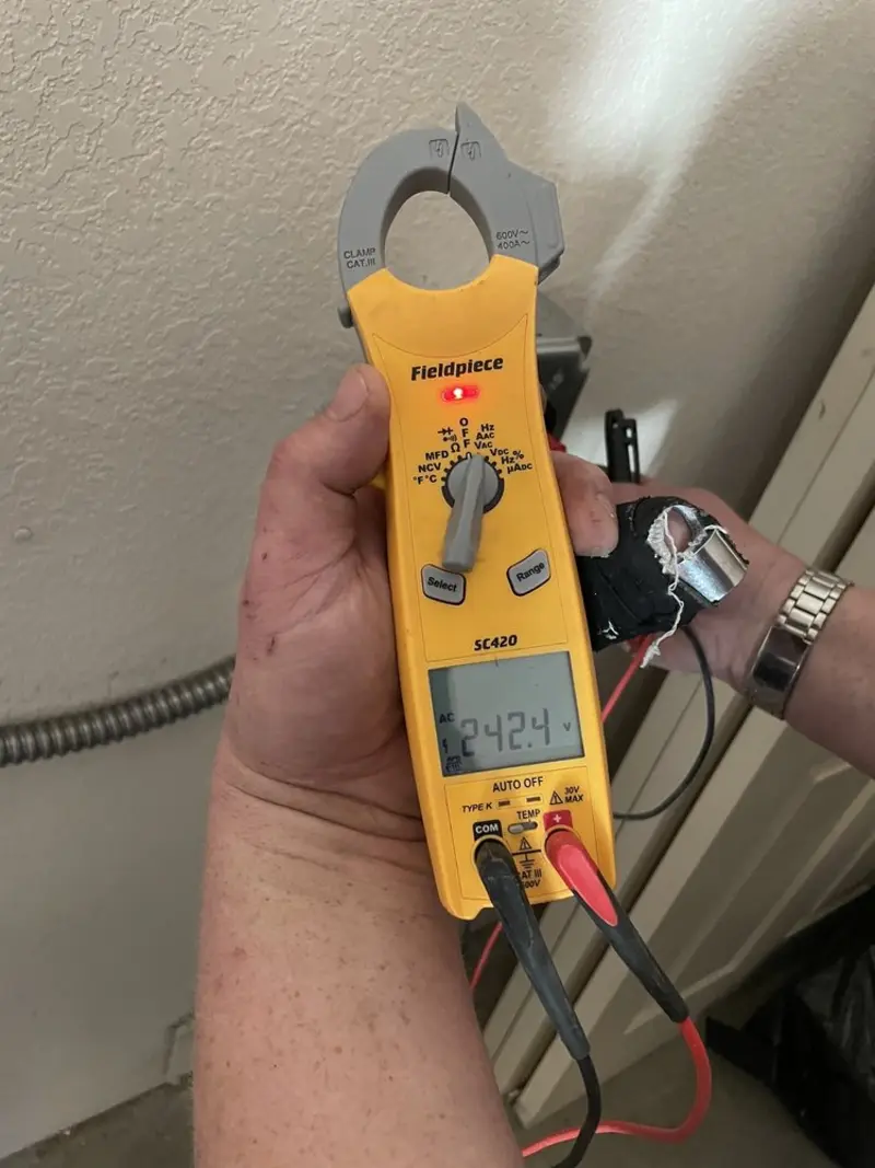 Voltage testing with clamp meter during Electrical Installation Services in Stratmoor